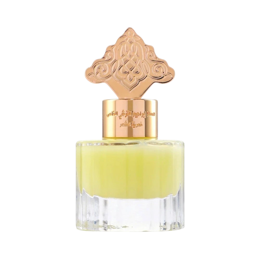 Hadiyyeh Ibraq cardamom musk hair mist in a clear glass bottle with an ornate rose gold decorative cap.