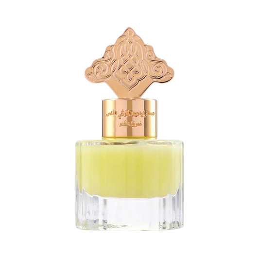 Hadiyyeh Ibraq cardamom musk hair mist in a clear glass bottle with an ornate rose gold decorative cap.