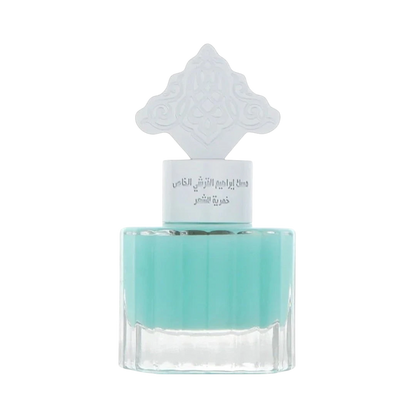 Hadiyyeh IBRAQ Powder Musk hair mist in a clear glass bottle with a decorative white cap and light blue liquid.