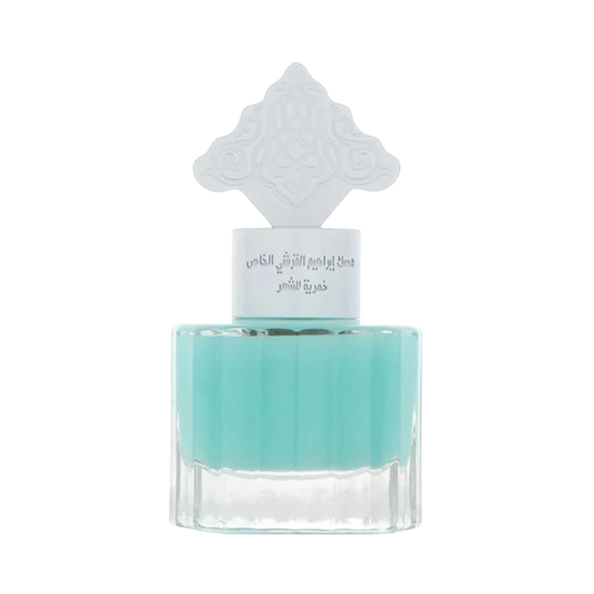 Hadiyyeh IBRAQ Powder Musk hair mist in a clear glass bottle with a decorative white cap and light blue liquid.